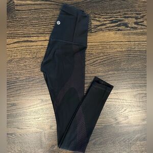 Lululemon black leggings with purple laser cut detail. Sz 2. EUC.